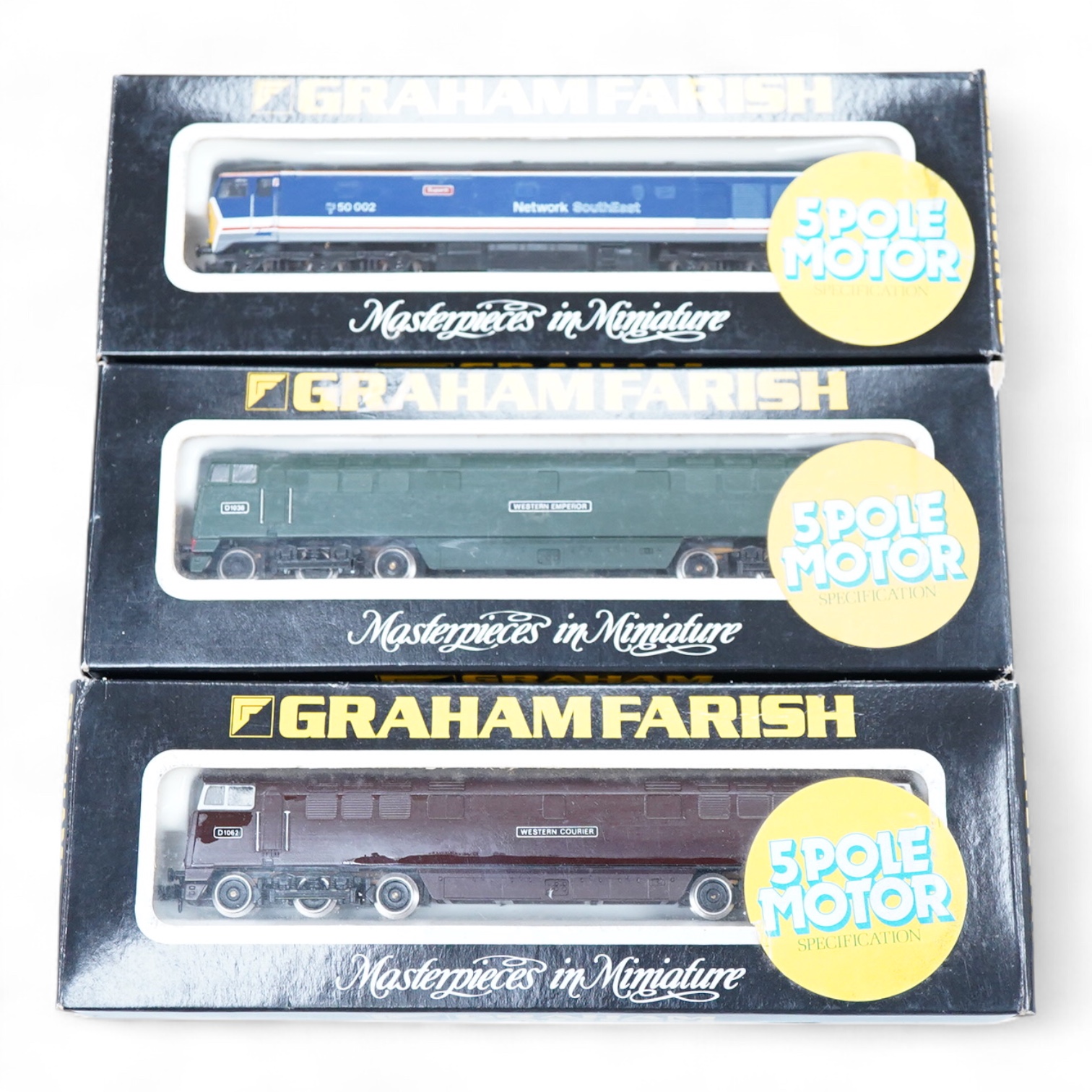 Three boxed Graham Farish N gauge railway diesel locomotives; a BR class 52, Western Courier D1062, (8426), a BR class 52, D1036, (8424) and a Network SouthEast class 50, Superb 50 002 (8408).